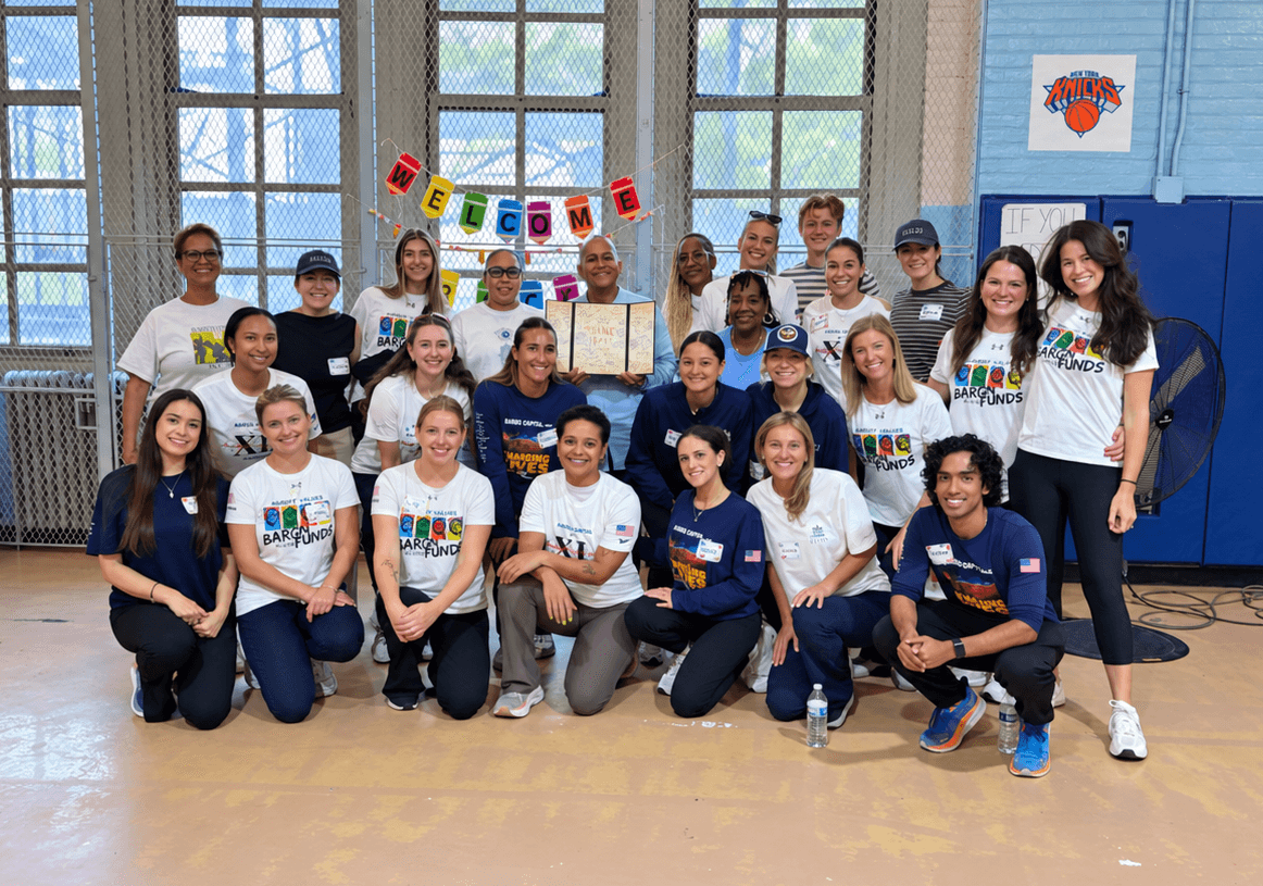 Baron employees giving back by volunteering to give new backpacks and school supplies to students at P.S. 63 Author's Academy in the Bronx.